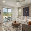 living room with couch and glass doors to balcony